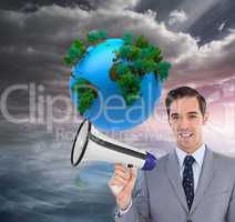 Composite image of smiling businessman holding a megaphone