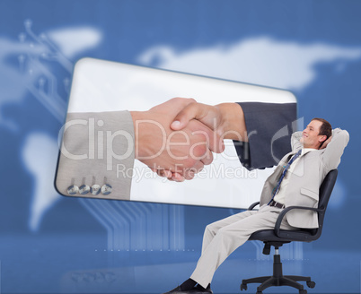 Composite image of side view of businessman leaning back in his