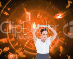 Composite image of angry businesswoman throwing her tablet pc