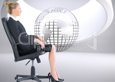 Composite image of businesswoman sitting on swivel chair in blac