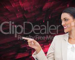 Composite image of smiling businesswoman pointing