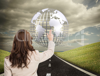 Composite image of brunette businesswoman standing back to camer