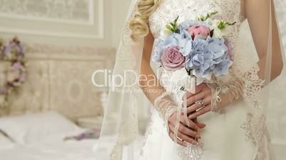 bouquet in the hands of the bride