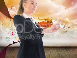 Composite image of businesswoman pointing somewhere