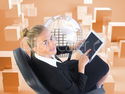 Composite image of businesswoman sitting on swivel chair with ta