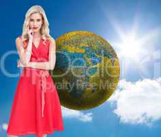 Composite image of thoughtful blonde wearing red dress