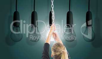 Composite image of businesswoman pulling a chain