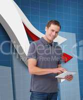 Composite image of smiling young man with tablet computer