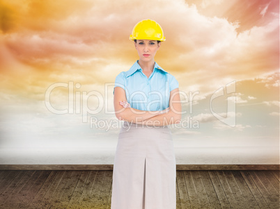 Composite image of serious pretty architect posing
