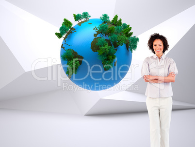 Composite image of businesswoman with crossed arms