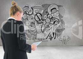 Composite image of businesswoman holding tablet