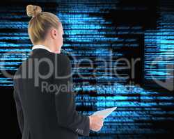 Composite image of businesswoman holding tablet