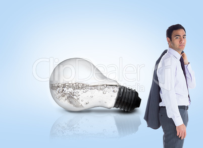 Composite image of unsmiling businessman standing