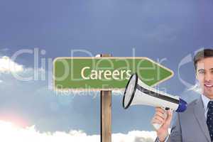 Composite image of smiling businessman holding a megaphone