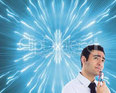 Composite image of thinking businessman holding glasses