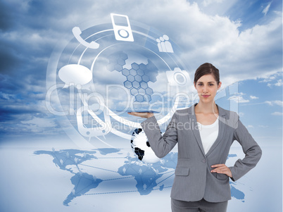 Composite image of smiling businesswoman holding tablet pc