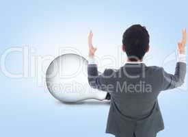 Composite image of businessman with arms raised