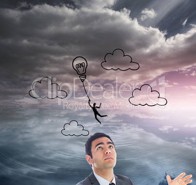 Composite image of unsmiling businessman catching