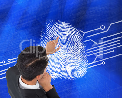 Composite image of thoughtful asian businessman pointing