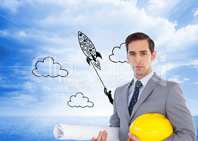 Composite image of serious architect holding plans and hard hat