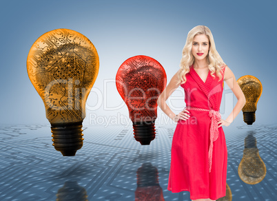 Composite image of elegant blonde standing hands on hips