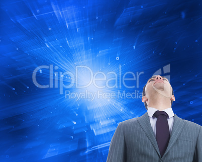 Composite image of unsmiling businessman standing