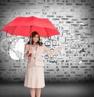 Composite image of happy businesswoman holding umbrella