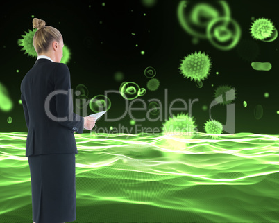 Composite image of businesswoman holding new tablet