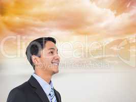 Composite image of smiling asian businessman