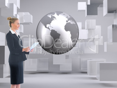 Composite image of businesswoman holding new tablet