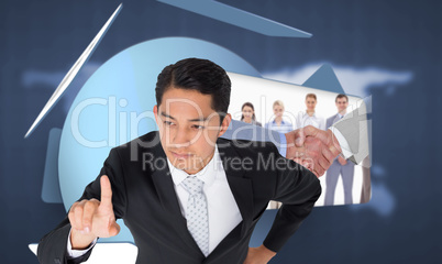 Composite image of unsmiling asian businessman pointing