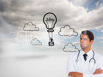 Composite image of confident doctor with arms crossed looking up