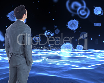 Composite image of businessman standing