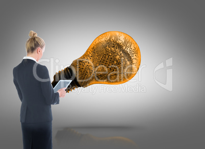 Composite image of businesswoman holding new tablet