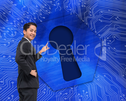 Composite image of smiling asian businessman pointing