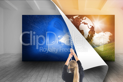 Composite image of businesswoman pulling a chain Composite image of businesswoman pulling a chain