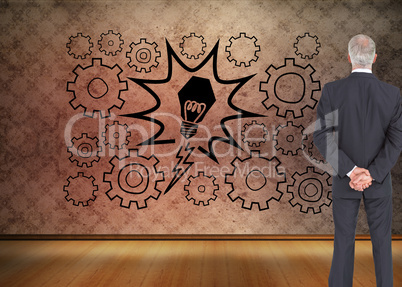 Composite image of rear view of serious businessman posing