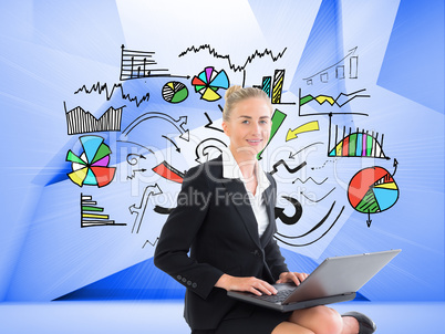 Composite image of businesswoman using laptop