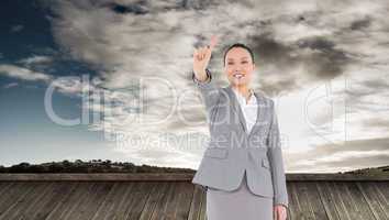 Composite image of smiling asian businesswoman pointing