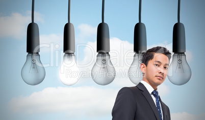 Composite image of five light bulbs in row