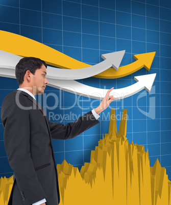 Composite image of serious asian businessman pointing