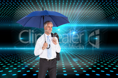 Composite image of happy businessman holding umbrella