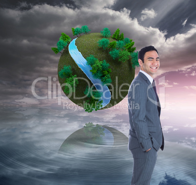 Composite image of smiling businessman standing