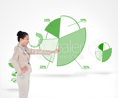 Composite image of smiling asian businesswoman pointing