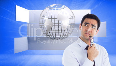 Composite image of thinking businessman holding glasses