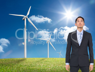 Composite image of serious asian businessman