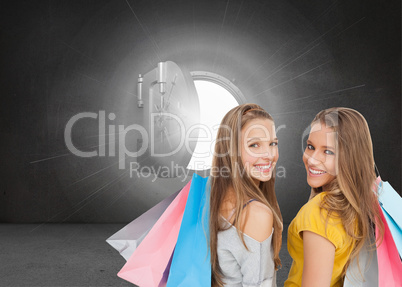 Composite image of two young women with shopping bags