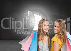 Composite image of two young women with shopping bags