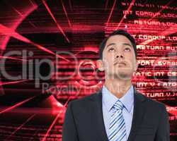 Composite image of serious asian businessman