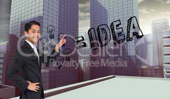 Composite image of smiling asian businessman pointing